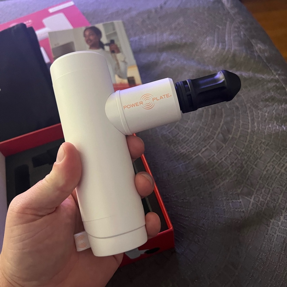 Power Plate mini portable massage gun.  Brand new - never used in box!